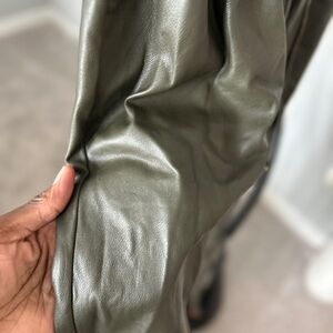 Army green faux leather capri pants. Hits at ankle.